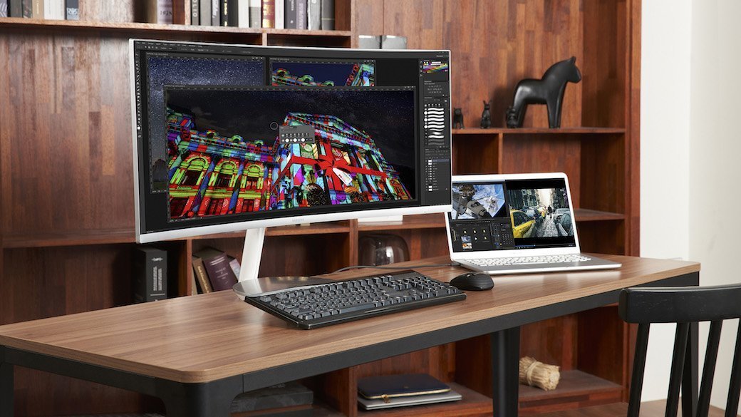 Curved monitor sitting on a desk