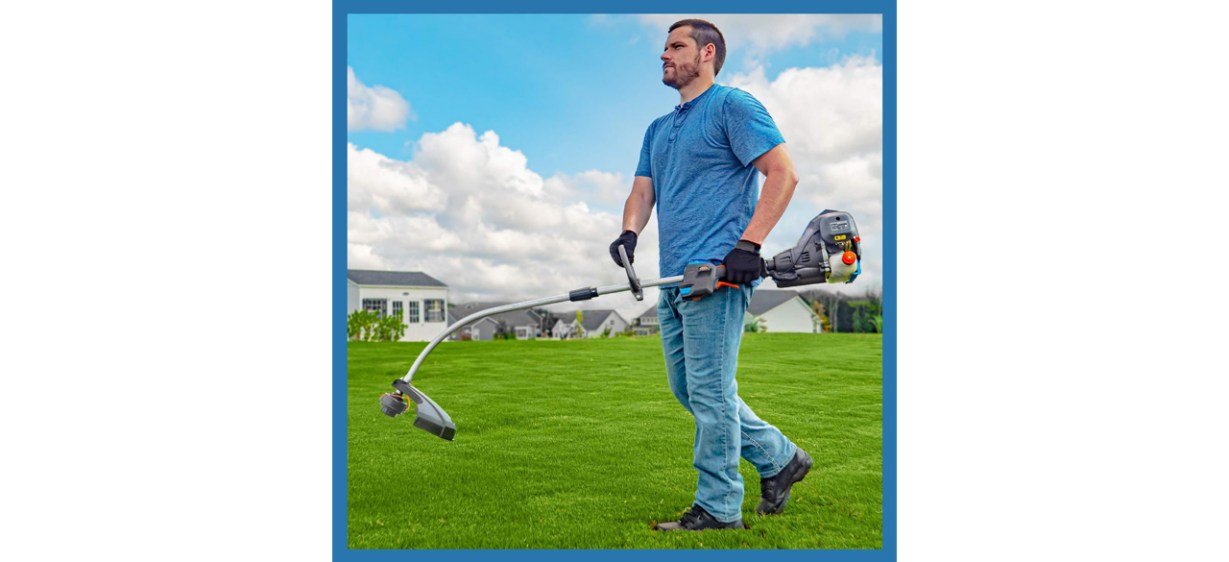 Man walking across lawn with LawnMaster No-Pull Gas String Trimmer