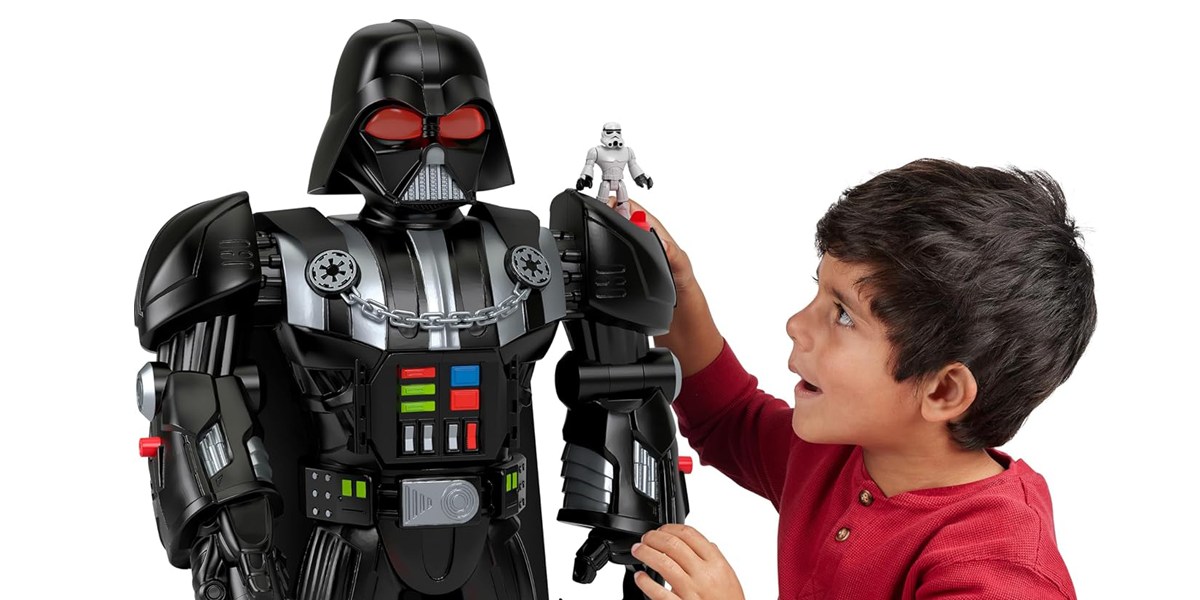 Darth vader toy and boy playing Darth vader toy and boy playing