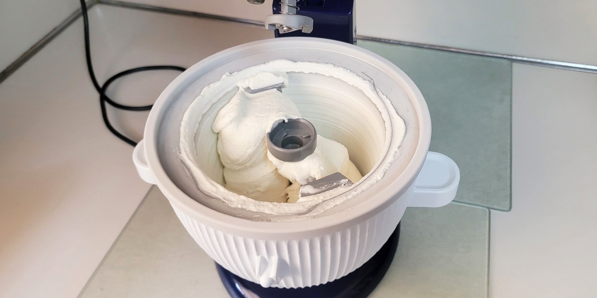 Top view of KitchenAid Ice Cream Maker Attachment with vanilla ice cream inside Top view of KitchenAid Ice Cream Maker Attachment with vanilla ice cream inside