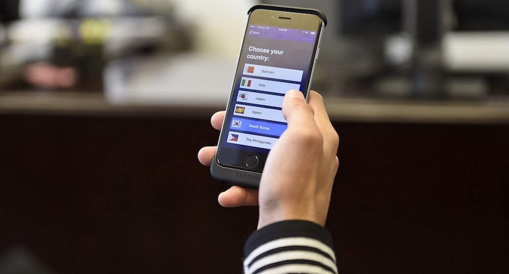 A person holding TracFone.