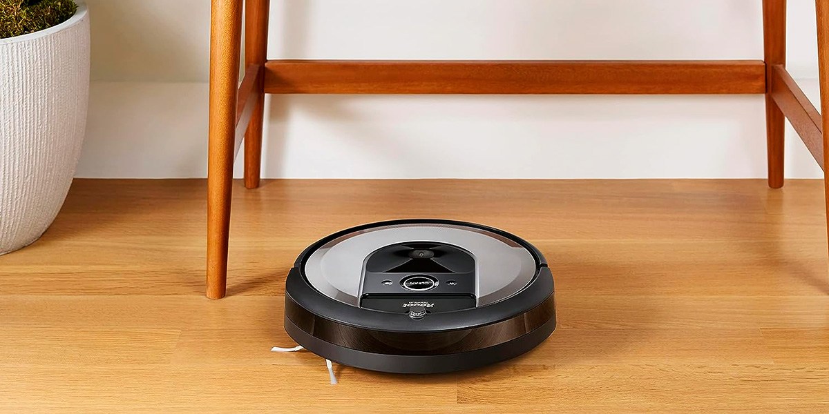Roomba navigating on hard flooring under chair