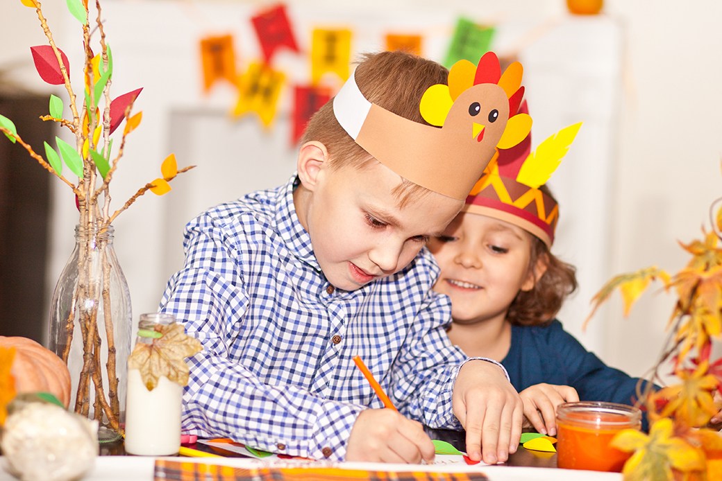 Children making turkey costumes