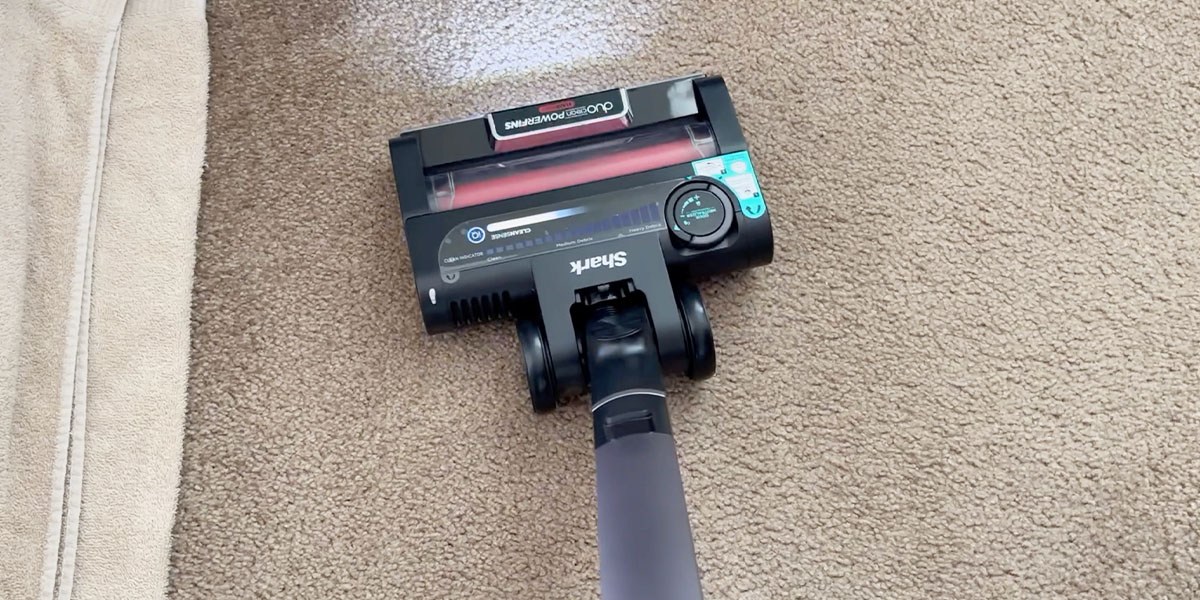 Shark Vertex Cordless Stick Vacuum cleaning carpeted flooring
