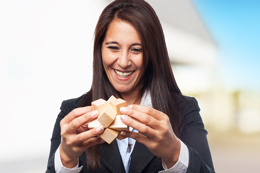Woman solving 3D puzzle